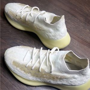 White and cream Yeezys men’s 10
